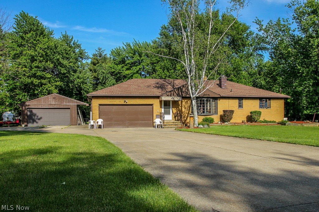 Beautiful Brick Ranch nestled on 1.3 acres on a quiet street in the heart of North Royalton. Road travelers, water lovers & car buffs will appreciate the RV/Boat pad & extra 2 car garage/outbuilding. Loads of important updates include 2 new panel boxes & circuit breakers (2012), roof (2006), Pella windows & doors (1999), Basement waterproofed (1999), Natural gas generator (2012), water softener (2013) & much more! Inviting living room w/ cozy fireplace & bright bay window. The dining room opens to the kitchen that offers a breakfast bar, ample cabinet & counter space & all appliances are included! 3 bedrooms & 1 1/2 baths. Master bedroom w/ en-suite 1/2 bath. Enjoy the peaceful view of the gorgeous backyard from the sunroom, deck and patio! The 38x13 finished lower level is a great place for kids to play, workout or have game night and play pool on the included pool table. 1 yr home warranty also included! This great home & property have so much to offer! Wonderful value!