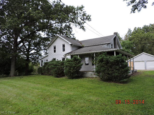 This one is easy to pass up. This century plus colonial home sits back off the road. Has side covered porch, sunroom and large spacious living room and dining room. Semi modern kitchen and first floor master suite with bath. Second floor has updated modern bath. Oversized 2c det garage and 1+ acre lot.