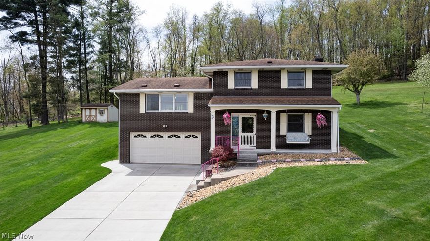 WEIRTON AREA....A Dream Come True at this peaceful rural setting w/a perfect blend of comfort & Charm, located approx. 2.7 miles from Weirton city limits is the one you have been waiting for, home w/2 add'l lots equal 1.39 acres  of cleared usable land. 3 BR/w Master BR leading to a Jack N Jill remodeled bath, 1.5 Bath Tri-Level brick home.  Step into the large tile foyer that leads to a warm spacious Family Rm w/gas fireplace encompassed by a stone wall to welcome family/friends.  Entertain or unwind in nature in this charming Florida Rm surrounded by windows, sliding doors & cathedral ceiling w/skylights & beautiful wood insulated floor.  Equipped eat in kitchen, tile floor w/spectrum lighting. Custom blinds thru-out. LR w/delight w/a view of the valley.  Covered front porch overlooking the serene countryside. 2 car integral garage & new driveway. Back yard shed.  Don't miss this meticulous home shining w/pride of ownership.