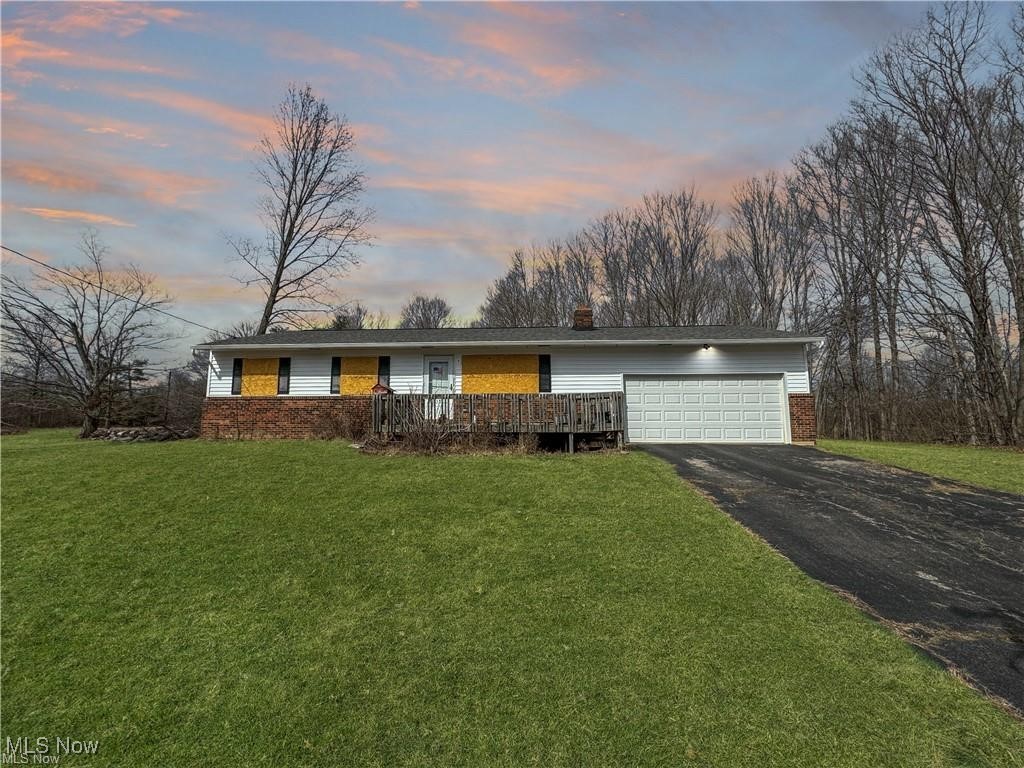 Check out this fantastic 5 acre property located in a highly sought-after area, close to several new housing developments. the land is mostly open with some wooded sections and a serene creek running through it. the home itself is solid with a newer roof and siding, plus a durable poured foundation. Featuring electric heat and AC, the property also includes a spacious two-car garage. While the interior needs some updating and TLC, this is a great opportunity for a handyman special, or you could build your dream home here. This is a rare chance to own a beautiful property in a prime location. Don't miss out-schedule your tour today!
