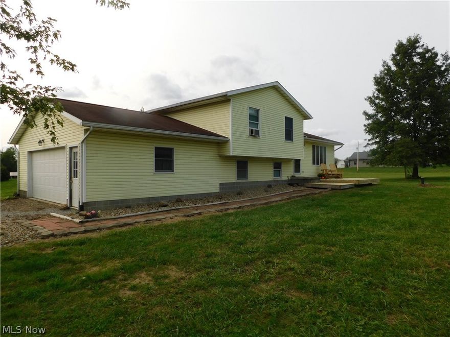 EITHER ONE OR BOTH. This 3 bedroom 2 full bath home was constructed in 1998 (one owner) has lots to offer. Easy drive to Amish Country and north end of Wooster.  Nice size rooms including separate living room and lower level family room. Recently added front porch deck.  Master bedroom has on suite bath and nice size closet.  2 car attached garage  plus a separate 32 x 72 shop with gas heat and air conditioning.  Shop has 2 over head doors, showroom area and lots of work space. All set up for home business or your own personal use. You could have option just on Shop and 1.50 acres or House on 1.969 acres.  Plans have been drawn up for the split and approved just not recorded to give buyers options.