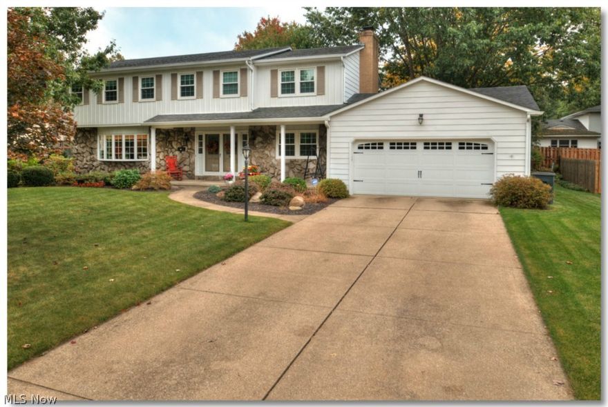 Spaciousness abounds in this updated 2500+ sq ft Colonial! 1st floor features a large foyer; freshly painted living room w/ crown molding & bay window; dining room large enough for your dining set w/ hardwood floors & beautiful wainscoting; updated kitchen w/ granite counters, ceramic tile floor, recessed lighting, stainless steel appliances & newly installed breakfast bar w/ additional storage space; unique butler's pantry located between kitchen area & family room; huge family room w/ hardwood floors, woodburning fireplace w/ heatalator & built in bookshelves leads to enclosed porch & patio! Roomy 2nd flr features extra wide hallway leading to an oversized owner's suite w/ his/her closet, master bath with granite topped vanity, 3 additional ample sized bedrooms, 2 featuring hardwood floors, updated guest bath with new porcelain tile floor & an oversized storage closet off hallway! Lower level includes a huge rec room w/ berber carpet and  built-ins!