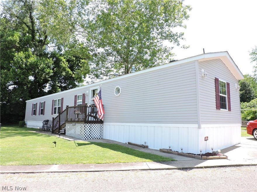 Just bring your personal belongings..... move in and enjoy this beautiful 3 bedroom, 2 full bath, furnished, 2008 Skyline Sunwood  16 x 80 mobile home sitting in Hillsboro Mobile Home Park on the only double lot, located minutes from downtown Marietta, easy access to I-77 and near amenities.  Features light and airy living room with accent lights, corner hutch, beautiful hutch with frosted glass cabinets above, counter space and cabinetry below for great storage, large table space kitchen with abundance of cabinetry, work island w/electric and storage, appliances (gas range, refrigerator, dishwasher, microwave) and table space by the window, conveniently located laundry room with washer/dryer and door from the backyard.   You will love the split bedrooms with the large master bedroom having walk-In closet and full bath with corner garden tub and separate shower on one end with 2 bedrooms and private full bath with tub shower at the opposite end.  The home features gas forced air heat w