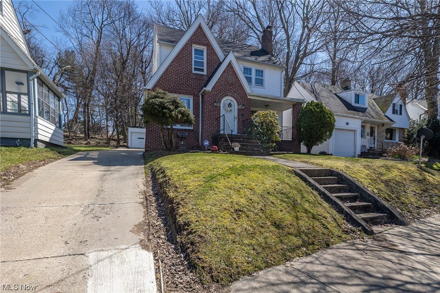 This charming Tudor-style home is located in Cleveland Heights and boasts four spacious bedrooms. The exterior features classic brick and vinyl siding while the interior is filled with natural light and original details. Upon entering, you'll be greeted by a cozy living room with a wood burning fireplace and hardwood floors that continue throughout the home, The adjacent dining room is perfect for hosting dinner parties, and the updated kitchen features stainless steel appliances, granite counters, and ample storage. Upstairs, you'll find four generously-sized bedrooms, each with its own unique charm and full bathroom. Additional features of this home include an office with full bathroom, closed in porch, as well as a fenced-in backyard wit a detached two-car garage. New hot water tank and new roof on garage and front porch. Minutes from Case Western University, Cleveland Clinic, and Little Italy.