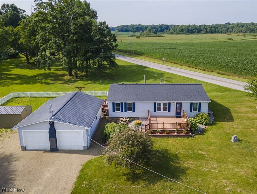 Welcome to 14025 Smith Goshen Rd, a beautiful country property located in the charming town of Beloit, Ohio. This exceptional home offers a tranquil and relaxing living experience, with the added benefit of being able to accommodate horses and livestock! This home sits on a corner lot just under 2 acres. With its expansive grounds, there's plenty of space to accommodate horses and other animals with a 12x20 run in barn, pond and other storage shelter for livestock. As you step inside, you'll be greeted by a warm and inviting interior that seamlessly blends rustic charm with modern comforts. The main living area features an open floor plan, allowing for easy interaction between the living room, dining area, and kitchen. The living room is perfect for cozy evenings by the wood burning fireplace! The primary bedroom is very spacious with a beautiful en suite bathroom and a walk in closet and the other two bedrooms offer ample space with another full bathroom. Updated kitchen counter top,