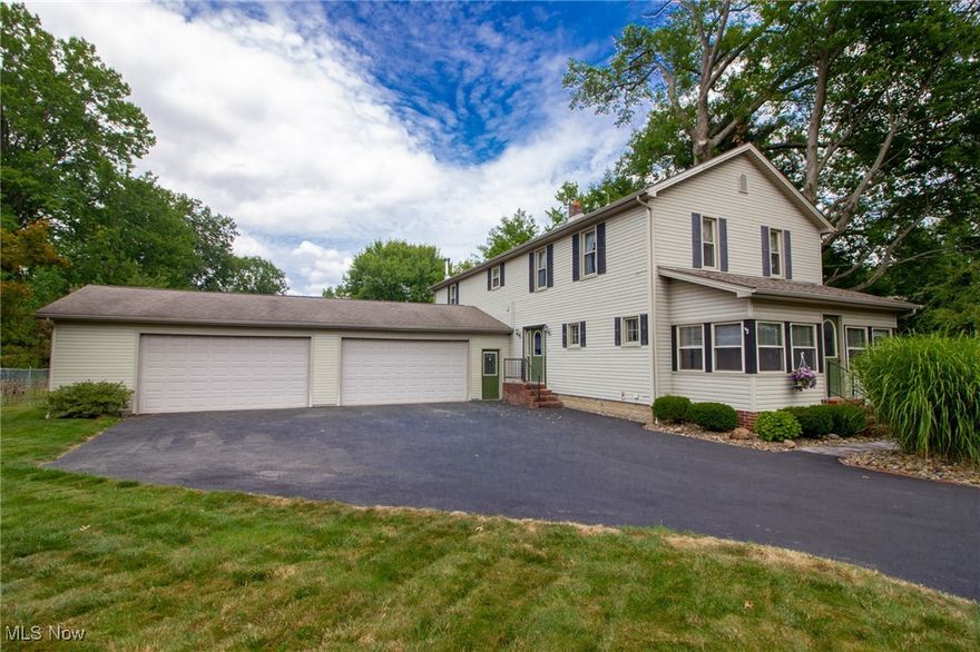 Welcome to 2128 Lyon Blvd — a stunning 5-bedroom, 3.5-bathroom, 2,796 sq ft home that blends modern updates, functional design, and incredible space for living and entertaining. Nestled on a picturesque 0.78-acre lot on the edge of Struthers and Poland, this property has been lovingly and meticulously updated over the past 22 years, including a substantial addition that expanded the heart of the home. Step inside to discover a custom-built kitchen with high quality finishes, ample cabinetry, & very generous counter space — perfectly positioned in an open floor plan that flows effortlessly into the massive main family room and dining area. This expansive layout was designed for hosting, whether it’s holiday gatherings or casual evenings with friends. The first floor also showcases a comfy living room, 1/2 Bathroom & elegant entry foyer. The addition also brought a spacious master suite with a luxurious feel, a super convenient second-floor laundry area, and a versatile fifth bedroom. 5 total bedrooms and 3.5 total bathrooms ensure comfort for family and guests alike. Outside, the property is equally impressive. A screened-in back deck opens to a spacious deck leading directly to a large rectangular above-ground pool, ideal for tons of summer fun. A 4.5-car garage with a rear garage door offers space for heavy equipment, a workshop, extra storage, or safely tucking away sports cars for the winter. Additional outdoor features include a lean-to shed, a large garden area, a firewood rack, 2 other patios that you can set up how you like, and a fully fenced backyard for privacy, security, and great for pets. The spacious backyard has hosted large family reunions of 75 people with room to spare. Located close to shopping, dining, parks, and recreational areas with quick freeway access, this home offers both seclusion and convenience. With its thoughtful upgrades, functional spaces, and unbeatable outdoor amenities, 2128 Lyon Blvd is more than just a home — it’s a lifestyle.