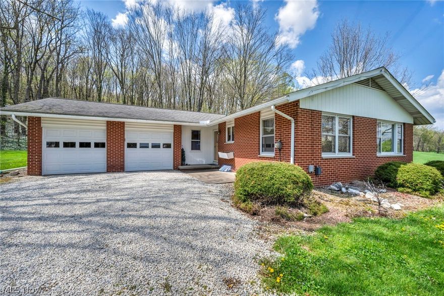 Welcome to this well-maintained 4-bedroom, 2 full bath brick ranch nestled on 3 beautiful acres atop a scenic hill in Wadsworth. Offering approximately 2,300 sq ft of finished living space, this home perfectly blends comfort, functionality, and peaceful country living.
Step inside to a warm and inviting living room featuring a stunning stone fireplace perfect for cozy evenings. The spacious kitchen offers ample cabinetry and workspace, flowing seamlessly into a dining area with picturesque views of the surrounding landscape.
Convenience is key with first-floor laundry and a practical layout designed for everyday living. The finished basement provides additional living space ideal for a recreation room, home office, or entertaining, along with a dedicated utility room for added storage and functionality.
Outside, enjoy breathtaking views from your hilltop setting, surrounded by open green space and mature trees. The property offers the privacy and tranquility of country living while still being conveniently located near both Wadsworth and Rittman.
Car enthusiasts, hobbyists, or those needing extra storage will appreciate the impressive 4-car garage featuring 3 bay doors, including a large rear-facing door for added accessibility.
This is a rare opportunity to own a solid, well-cared-for home with acreage, views, and versatility schedule your private showing today!