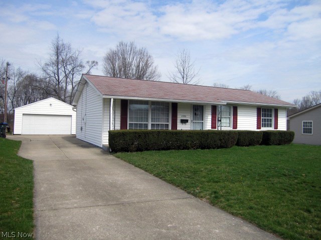 Exceptional ranch with updates galore! This Ranch offers so much...Please don't miss out. Sits on a beautiful lot it overlooks a private park area. This is a dead end street and really never sees much traffic. The is a "piggy backed 4 car garage that is truly set up for car lovers. Inside the home the open kitchen has been completely updated with flooring, cabinets and counters 1 1/2 baths that were also updated. Newer high efficiency furnace and Central Air. Basement has poured foundation and is in excellent condition. Off the kitchen is a heated sun room with fireplace wood stove and vaulted ceiling.