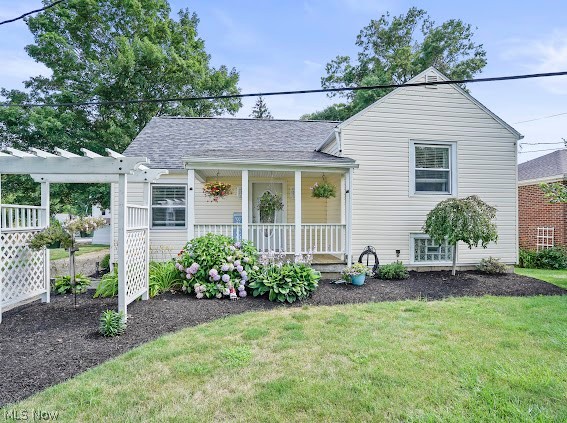780 E Main Street --- this 3 bedroom | 1.5 bath property is situated on over a quarter of an acre in the heart of Ravenna. One car attached garage with 2 driveways -- one being off of E Main and the other off of E Maple. Inviting curb appeal with a covered front porch. Light and bright spacious living area with built-in shelving and wood floors. Separate dining room with exterior access to the back covered porch, deck and backyard. Updated kitchen with maple cabinets, title & backsplash and lots of cabinet space w/ a built-in pantry. Up a couple of steps you'll find 2 bedrooms with original hardwoods and an updated full bath. The 3rd bedroom is on the upper level with built in storage. The full basement provides extra storage, W&D hook-ups w/ a wash sink and the half bath + the attached garage. This house has it all and is truly turn-key. cental A/C + vinyl windows throughout. Roof was replaced in 2021. Just moments away from all convenient amenities such as restaurants, shopping and more! Don't miss out on the opportunity to call this your very own!