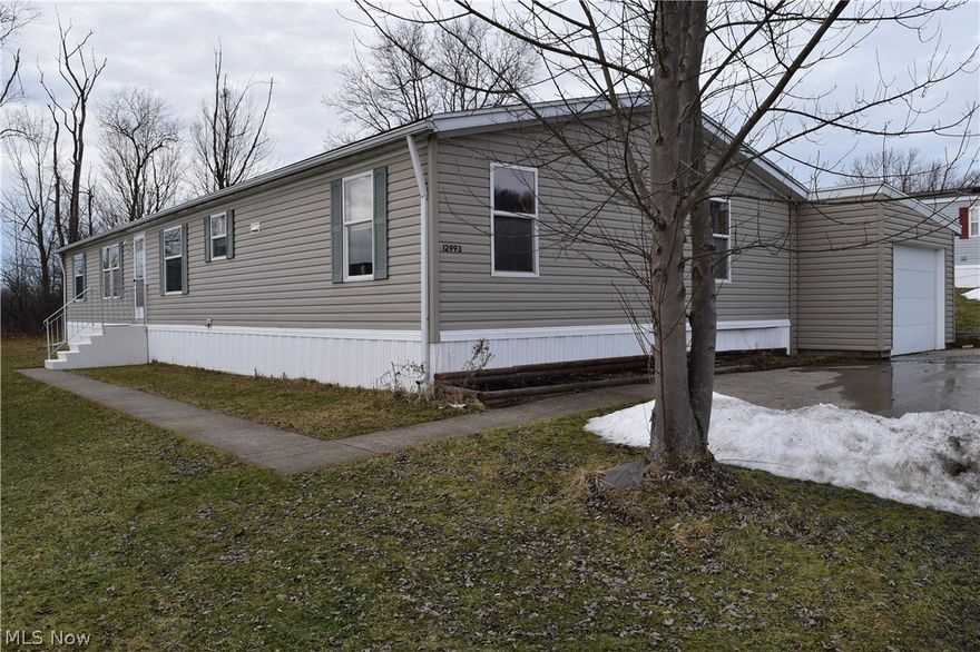 Spacious 3 Bedroom & 2 Full Bath double wide Mobile Home in Chardon School District! 1998 - 26x66 Redman Park model has over 1700 sqft of living space with open floor plan & newer wood laminate flooring throughout. Nice size Living Room, Family Room, Dining Room, Eat-in Kitchen with abundance of cabinets & counter space and all appliances are included. Large Master Bedroom with double closets & private full bath with garden tub. Washer & dryer stay with home and Laundry Room has access to 1+car attached garage. Large concrete apron for extra parking. New front steps. Storage shed. Community Park includes use of Club House, gazebo, pavilion & common green space. Close to schools, park, pool, shopping & Geauga Parks Mountain Run trails. Just minutes east of Chardon Square!