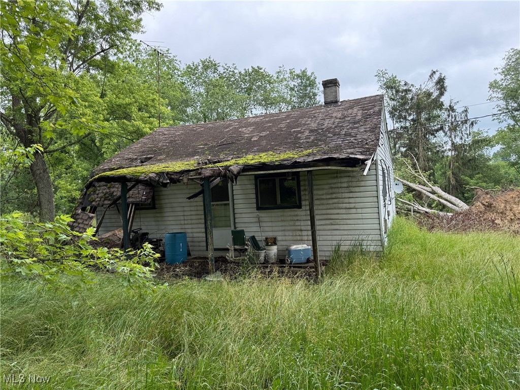 1.20 acre lot with home in need of repair.