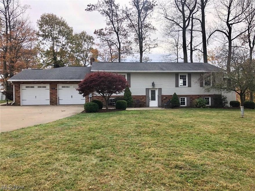 Combined parcels 1 & 2 of auction. A tremendous opportunity to purchase acreage with a raised ranch home and buildings in the Baltic/Ragersville area. The home was built in 1974 and the main floor features an open concept between the living room, dining room and kitchen (Schlabach Wood Design remodeled in 2009), as well as the master bedroom. The lower level has 4 bedrooms, a full bath, laundry room and lots of storage. Attached to the home is an In-Law suite that has full living quarters and a separate entrance to the 2-car garage. The outside offers plenty of room for horses, 4-H projects, etc. with the 40x56 shop/barn. The mechanics of the home include free natural gas, and a private well and septic. The vacant acreage offers excellent views, hunting, and potential building sites.