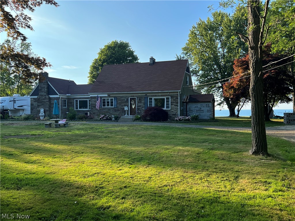 Welcome to this spectacular 5 plus private acres situated on LAKE ERIE. This home boasts 3 large bedrooms, 2.5 baths and full basement. This is a very secluded and private piece of property with decks out to the back of the property to view the sunrise and sunsets. Sit on the deck and enjoy your quiet evening sipping a glass of wine and hearing the waves crash. There is a hot tub on the deck for you to relax in. The kitchen is huge with beautiful granite counters and large granite island as well as new flooring. There are hardwood floors thru-out most of the house. There is a family room that is heated by it's own gas
fireplace plus there is a wood fireplace in the living room and fireplace in the master bedroom. This is such a quiet property that the only thing you usually hear are the boats and jet skis going by.