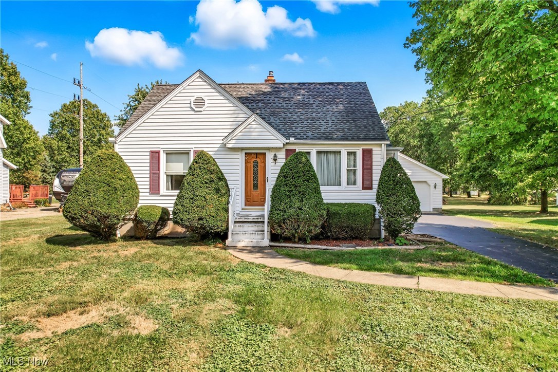 Fall in love with this picture-perfect 3 bedroom, 1 bath Cape Cod! Inside, you'll find gleaming hardwood floors throughout and a beautifully updated kitchen with stylish finishes and ample storage. The eat-in kitchen area is the perfect spot to enjoy meals. The main level features two comfortable bedrooms and a full bath with a tub, while upstairs offers a third bedroom plus a flexible space, ideal for a 4th bedroom, home office, or relaxing lounge area. Outside, the oversized 2-stall garage provides tons of storage or workspace, and the manicured yard offers great curb appeal in a peaceful setting. Maintained with great care for over 50 years, this move-in ready gem blends comfort, charm, and functionality- get ready to love it!