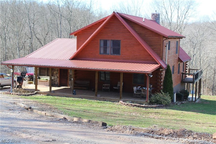 Secluded log home on either 5 acres ($310,000) or with 42 acres ($370,000) free gas. Open floor plan. Dining room, Kitchen with Jenn air duel fuel (electric oven, gas top) and attached kitchen appliances stay. Great room. Floor to ceiling WBFP. 1st fl laundry room, foyer, two 1st fl bdrms and FB. Walk around decking on first floor. Full basement has poured walls, large rec room area (mostly unfinished), completed full bath with walk in shower, office room, toy room, and storage rooms. Lower level has a covered patio area, 2 double doors with windows for lots of natural light. Plenty of storage areas and closets throughout and offers walk in closets in lofted master bedroom. Private Master Suite has an electric FP and full private bath. Lofted area overlooks the great room with FP. The lofted area offers a balcony/study area. Pole building is approx. 30 x 57 with 200 amp electric, water and gas . Some of the pasture is fenced. Priced below most recent appraisal completed approx 3-4 year