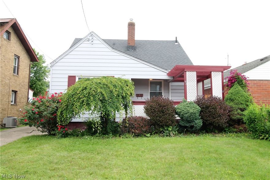 Welcome to this charming four-bedroom, one full bath cape cod home. Come on in from sitting outside on the covered front porch to the large bright living room which is open to the eat in kitchen. This home has been newly painted and offers new carpet, and new modern lighting throughout. The eat in kitchen has plenty of cabinets, stove, and ceiling fan. There are two bedrooms with ceiling fans and a full bathroom on the main level. Upstairs you will find two more bedrooms with ceiling fans which could be used as an office, workout area etc. The lower level offers a bar, and more storage, laundry area. There is a one car detached garage. Fenced in backyard. Own with Pride!