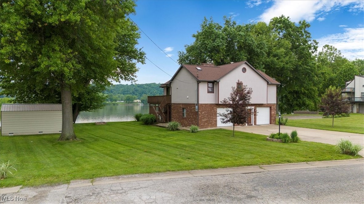 Beautiful Ohio River raised ranch with two bedrooms, 3 full baths, with a possible third bedroom on the 2nd floor bonus room. Many updates: granite countertops, refrigerator, microwave, hot water tank, washer, dryer, main bathroom, updated closets, sun setter awning, new AC unit, landscaping, and much more!!! Situated on a private dead-end street, this location has a double lot with 90 feet of river frontage. Extra-large garage/Recreation area with multiple decks (including a rooftop observation deck) to enjoy the wonderful views of the river. Storage building and boat docks on side lot included. The property is outside the Vienna city limits.
Additional lots available per a separate owner's listing. MLS #5079974
