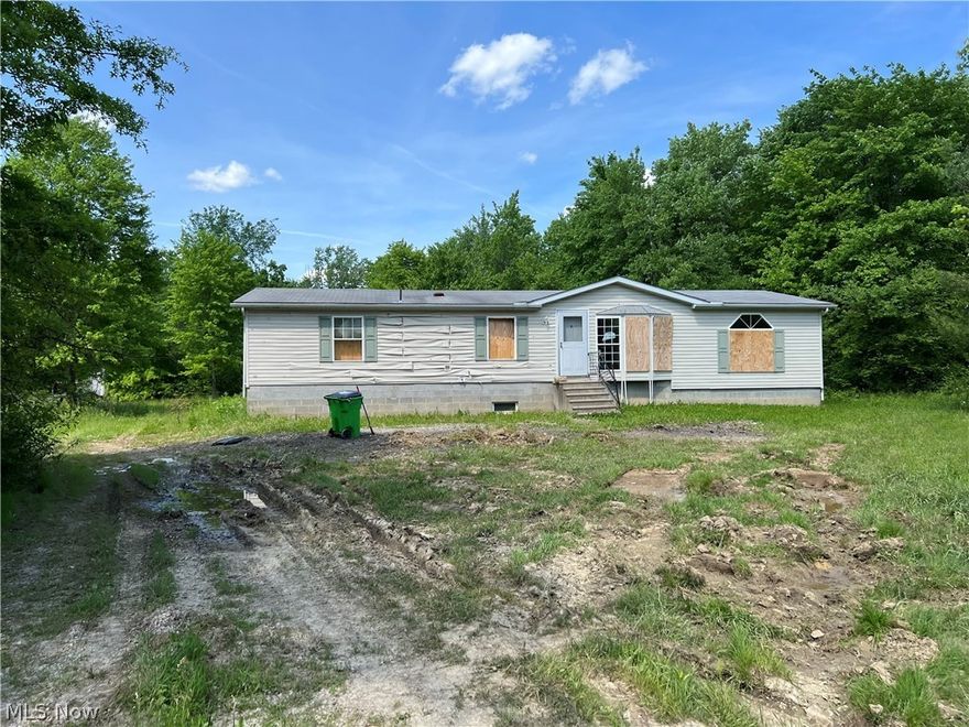 3 bedroom, 1.5 bath manufactured home on 5 acres in Parkman Township.