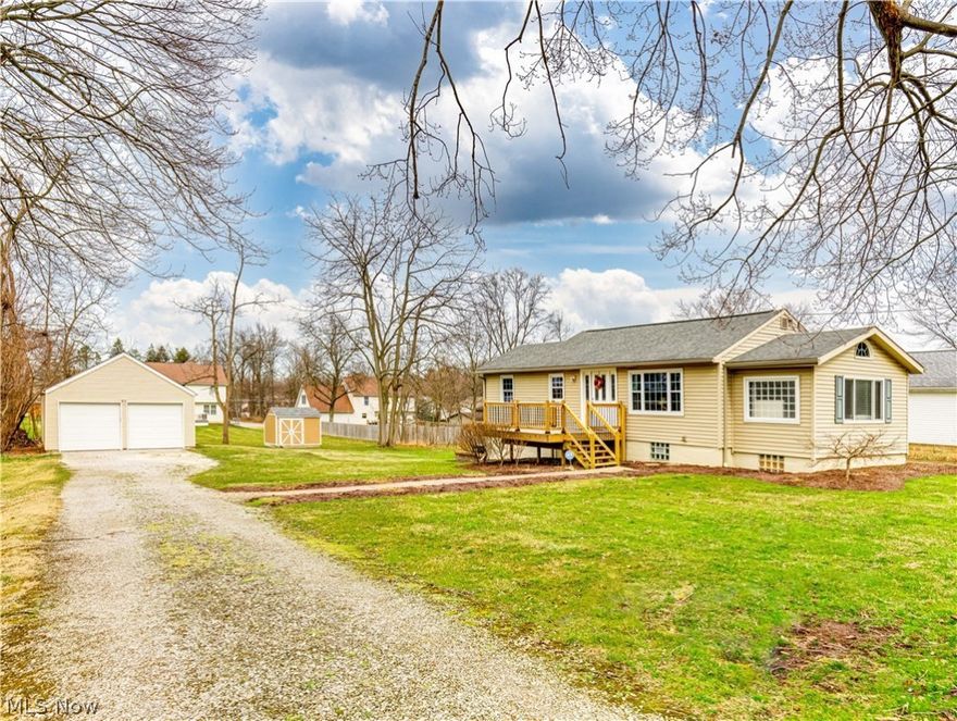 Beautifully maintained ranch home with 3 bedrooms in Tallmadge. Enter your new home off your brand new front porch. Once inside you will be welcomed with so many updates and natural sunlight. With an open concept you have the living room with hardwood flooring and into the kitchen to make conversations flow. Painted in neutral colors just waiting for your personal touch. The kitchen features tile backsplash, white cabinetry, tile flooring and stainless-steel appliances. Off the living room you can step down into a nicely sized bedroom with a large window, ceiling fan and large closet space. Another generous size bedroom off the living room with ceiling fan, hardwood flooring and ample closet space. Off the kitchen is a carpeted bedroom with a ceiling fan and nice windows to let in the sunshine. A large full bath with tile flooring completes the 1st floor living. Downstairs is a walkout basement with laundry area. Outdoors is a 2-car detached garage and storage shed in your nice backyard. Perfect space for a BBQ area in time for summer. Call today to schedule your personal tour today and make this gem yours.