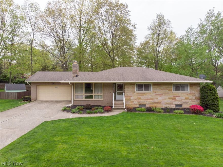 Spectacular Fairlawn Heights all brick 3 bedroom/2 bath ranch with stately stone front - AND a wonderful back yard!  Step into a welcoming foyer w/coat closet, then open up into a warm and bright living room w/stone front wood burning fireplace, and cheerful open dining area, featuring sliders to the newer back deck.  The huge deck overlooks a spacious and flat back yard! The kitchen has been updated with country cabinets, counter tops and flooring, also offering a large picture window to the back yard!  All bedrooms are ample size, and master is complete with it's own en suite bath.  You'll love both full bathrooms which have been updated with flooring, counters, fixtures, yet still have the retro-chic black tile in pristine condition!  Aside from the kitchen, hallway and bathrooms the entire 1st floor features refinished hardwood flooring. Convenient first floor laundry has been added at the top of the basement stairs - or could easily be moved back down. The full basement is huge, c