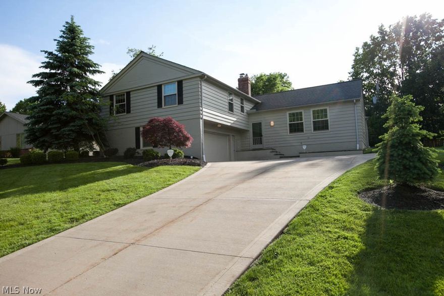 Beautiful and spacious 4 bedroom, 2.5 bath split level in the 
heart of Shaker Heights. Features a stunning cathedral ceiling Living Room with beautiful hardwood floors, gracious formal Dining Room, perfect for all of your entertaining. Large white & bright eat- in Kitchen, includes double ovens, loads of cabinetry and lovely breakfast bar.  Very spacious Family Room with beautiful wall of windows that look out over recently  professionally landscaped yard, plus sliding doors open to large walk-out deck.  Second floor features  4 spacious bedrooms, including master bedroom with attached master bathroom. Lower level features large finished and carpeted room with fireplace, could be used as a media room, exercise room, office or playroom. Other highlights include: First floor Laundry,    2 car attached heated garage, great feature for Cleveland winters. Freshly painted throughout, Newer driveway, Home Warranty .  BONUS: This home comes with never used, Pella Replacement Windows . Move-i