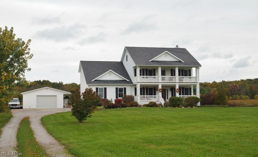 Thinking of building? Check out this gorgeous home and exceptional value on 5 acres with a barn!  Not likely that you can duplicate the size, quality, and features, all on 5 acres, for anywhere near this price.  And the huge vintage barn is a free bonus! Distinctive architectural features include 2-story front porch, 9 ft first floor ceilings, first floor office, 2 car att’d garage plus add’l detached w/workshop, hot tub/sunroom, back entry hall, huge first floor laundry & full bath, finished 3rd floor w/5 closets! Luxury finishes abound: solid cherry cabinetry (42” uppers in kitchen), woodwork, built-ins & wainscoting, Anderson double-hung/tilt-in wood windows, private master bath w/steam shower, tray ceiling & marble floor in dining rm., new wood laminate in office & family rm.  Finished basement is too cool w/pub room, media & exercise areas, full bath, locked safe room for collectibles. Efficient dual heat system, central air, city water!  Lovely paver walkway and mature landscapin