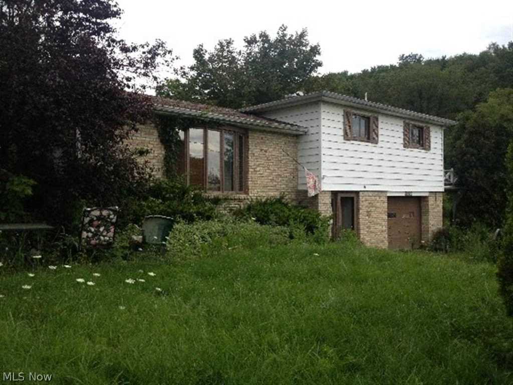 This home is a multi-level style with 3 bedrooms and 2 baths. Country settiing with 2.11 acres. Attached garage. Great size living inside and out!