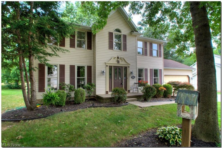 You will love coming home to this Beautifully Updated Colonial in the Villages of Meadow Wood. The gleaming hard wood floors and wooden staircase greet you as you enter the foyer.  This center hall colonial offers a formal Dining Room as well as a formal Living Room that opens up into a large Family Room with a cozy gas fireplace for easy entertaining. The kitchen is a cook's delight and features updated cabinets, granite countertops with a breakfast bar as well as shiny newer Stainless Steel Appliances.  The sliding glass door opens to a private relaxing patio, private wooded views and basketball court. The upstairs features a Master Bedroom Retreat with a gorgeous updated Ensuite Bathroom and large Walk-In Closet. The updated Master Bathroom (2013) has a jacuzzi, jetted bathtub with floor to ceiling tiles along with a granite vanity. Three large Bedrooms and an updated Hall Full Bathroom round out the 2nd floor.  The lower level features a large media room and an additional room that