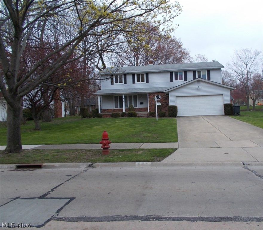 Spacious colonial in area of quality homes. Living room with large picture window. Dining room overlooks treed backyard. Large kitchen with eating area. Family room with sliders to patio, raised hearth, reclaimed brick fireplace. Laundry room on 1st. Slate tile entry foyer with convenient traffic pattern. Huge Master Bedroom with bath, vanity & dressing area, walk-in closet. 3 other generous sized bedrooms. Front porch; rear patio. Easy care vinyl exterior. Replacement windows. Convenient location, close to main roads, shopping, freeway.