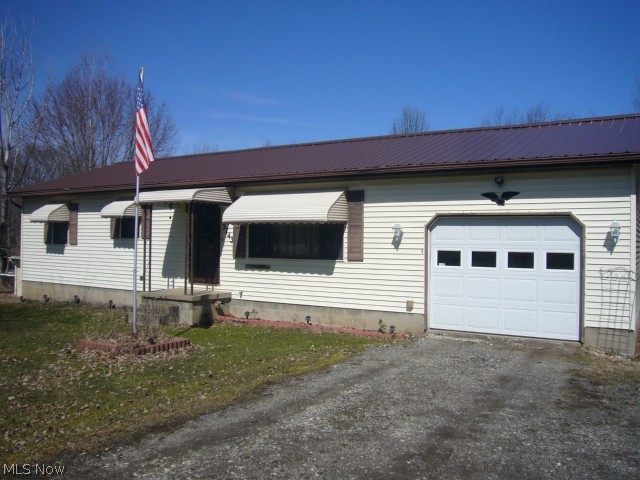 Built in 1991 this 2-3 bedroom, 2 bath ranch is simply the right size country home on 1.7 acres! * Offers a 1-car attached garage plus a 24 x 32 outbuilding for many uses * Great open floor plan kitchen with abundant cupboards and counter work space * Easy-access slides onto windowed sunroom with door to 16 x 8 wood deck to overlook and enjoy outdoor nature all year round * Laundry located on 1st floor * Two full baths on main floor; one private in master bedroom * Clean steam heat, nice white tile, 2 year old steel roof on home, nice storage throughout, 200 amp electric, hunter fans in each room * Walkout basement was built 12-block high offers 3rd bedroom option, large recreation room, and two additional storage rooms * Additional storage shed 12 x 12 * Pines line property line, small stream runs on one side makes this great for gardening, playing or comfortable living * Located near 224, 44 & 76 * Much to offer - Call today!