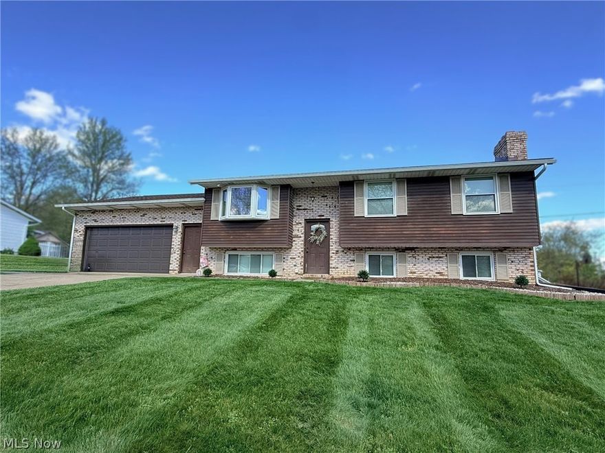 Well-Maintained Home Near Tuscora Park with Space to Enjoy Inside & Out.
3 bedroom, 2 full bath bi-level home in a desirable location. Main level features three bedrooms with large closets, a full bath, eat in kitchen equipped with appliances and slider that walks out to a newer 16x24 composite deck—perfect for entertaining or relaxing. Bright sunroom with vaulted ceilings adds additional living space and natural light.

Lower level offers a large rec room with a brick fireplace, second bath, plus an additional room ideal for a 4th bedroom, office, or flex space. Situated on a spacious 125x125 lot with a concrete pad for a basketball hoop or outdoor recreation and attached 2-stall garage. New roof and regularly maintained HVAC provide peace of mind. A well-rounded home with space, functionality, and a great location. Contingent on sellers purchasing home of choice.