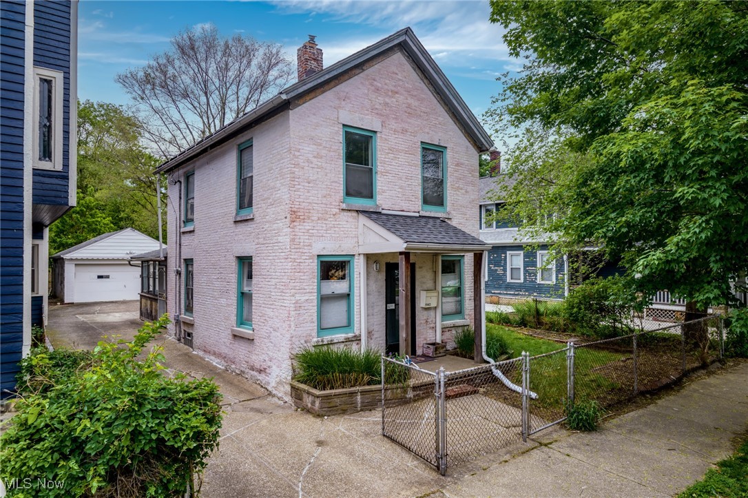 Discover a harmonious blend of historic elegance and modern convenience in this beautiful historic brick Ohio City home. Take advantage of a prime location, with bustling bars, artisanal breweries and scenic parks all just a short stroll away. Inside, you will find a home with attention to detail in design as well as historically-inspired updates that include replica windows, refined trim, and beautifully refurbished exterior brick walls. Stunning hardwood flooring throughout create a warm and inviting atmosphere. The first floor has a spacious living room, dining room, office, breezeway, eat-in kitchen and stylish full bathroom. The modern kitchen has ample storage space, full suite of stainless appliances and minimalistic flare. Upstairs, find two very spacious bedrooms with light flooding in. Current owner has installed custom window treatments throughout! Through a handy breezeway, find a fully fenced backyard that offers endless possibilities for gardening, entertaining or relaxation in the city! Not every day you can find an oversized 2 car garage in his historic neighborhood. Excellent proximity to downtown Cleveland, highway access, as well as the beautiful shores of Lake Erie! Don’t let this opportunity pass you by!