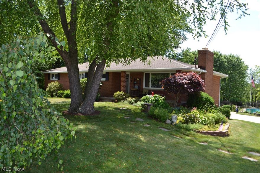 Wonderful brick ranch on a peaceful 2.5 acre treed lot with heated fiberglass in-ground swimming pool, beautiful landscaping, perennials, mature trees and privacy.  Features a remodeled covered front porch, 4 nicely sized bedrooms with hardwood floors under carpet.  Master bedroom with full bath and second full bath on main floor.  Great room has wood burning fireplace. Neutral colors throughout. Finished lower level with glass block windows and 1/2 bath.  The heated garage is extra deep. State of the art septic system installed along with considerable new plumbing and electrical 8/16.  Yard will be reseeded.  Other updates: kitchen, shower, driveway, insulation in attic and garage. Home is clean and well-cared for.  Sellers have lived there 41 years!