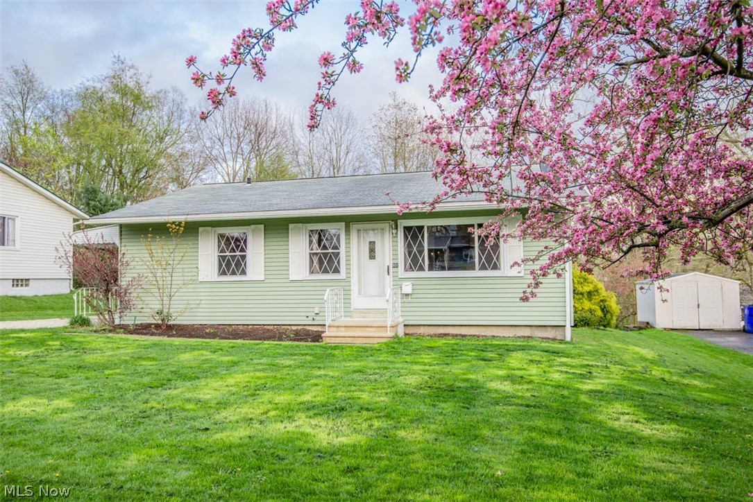 Move right in! This well-maintained 3BD/1BA Kent ranch home is located on a quiet and tree-lined street in an established west-side neighborhood. The well-appointed kitchen features a newer range, dishwasher, and garbage disposal and passes through to the large and open living room with plentiful windows that let in loads of natural light. Sleep easy with all three bedrooms situated on the rear of the house overlooking the private backyard. Love the look of wood floors? No problem. Original hardwood floors exist under all carpeting on first floor. The dry and clean basement has been divided into separate rooms and provides endless possibilities for extra living space and loads of storage. One room is plumbed for a toilet and could be turned into additional bathroom. There is also an additional finished bonus room that could be used as an office, craft room, workout room - you decide! HVAC was replaced in 2018 and entire exterior was recently power washed and is sparkling and ready for