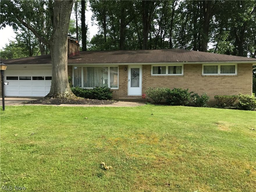 This charming 3 bedroom, 2 bath ranch is located in a park-like setting with mature trees on 2 lots = .55 acre. Living room has beautiful brick wood burning fireplace, off dining room is a 19x21 wood deck. some hardwood floors. Rec room in basement has gas fireplace. Furnace & AC in 2016, HWT 2010, 10X16 shed in backyard.