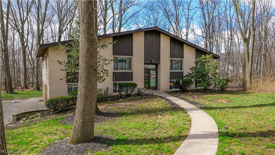Welcome to this spacious, well-maintained home located at 447 Spring Grove Dr. in the highly sought-after community of Tallmadge. Owned by only its second owner, this impressive property offers 2,976 square feet of living space on a generous 0.40-acre lot with a private wooded backyard, providing both space and tranquility.

Built in 1968, this two-story bi-level home features 5 Generous sized bedrooms, 3 full bathrooms and Heated 2 car Garage. Recent updates include a new roof (2024) , new garage door (2024) , Updated Electric Panel (2023) and a newer furnace (2021) , giving buyers peace of mind and added value. The home's spacious layout offers plenty of room to spread out, entertain, and enjoy comfortable living both inside and out.

Situated in one of Tallmadge's Very desirable neighborhoods, this property combines size, location, and potential. An excellent opportunity for buyers looking for a large home in a beautiful setting.