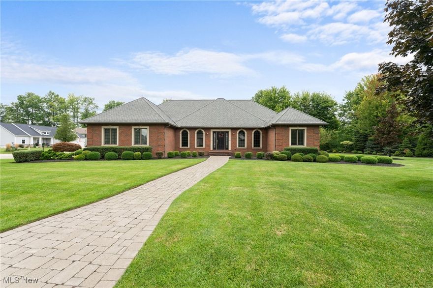 Welcome to 4453 Darlington Court in the sought after neighborhood of Stonegate in Saybrook Township! This custom-built full brick ranch home has been thoughtfully designed and pristinely maintained by the homes first and only owner. The landscaping and grounds provide a private feel and gorgeous views on the property. Custom features like a brick paver driveway, a two-sided gas fireplace, beautiful custom woodwork, hardwood flooring, coffered ceiling, expansive room in the basement with extra tall ceilings, walk in ADA shower and so much more need to be seen to truly appreciated. This grand home blends warmth and character with the convenience of first floor living on over 2600 sq foot. A fenced back yard is perfect for your four-legged friends or to sit out on the brick paver patio to enjoy the views. Don’t miss the chance to live in one of our areas most prestigious homes- call your Agent today!
