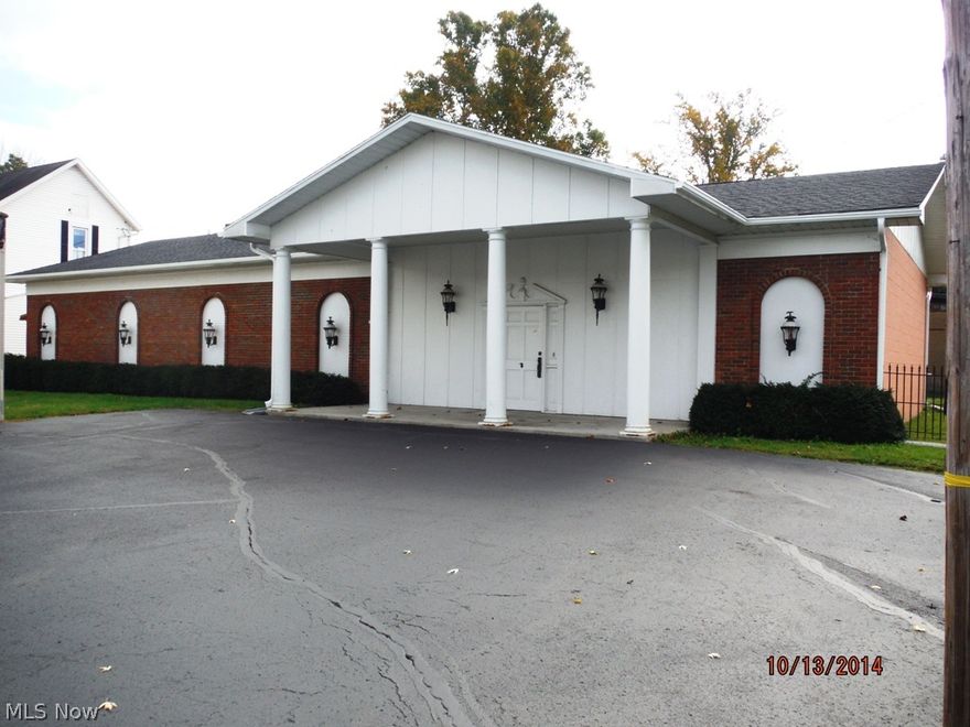 Beautiful brick front building offering Huge multi-purpose room, office, two 1/2 baths, kitchenette in utility room, paved parking lot and additional parking is available.