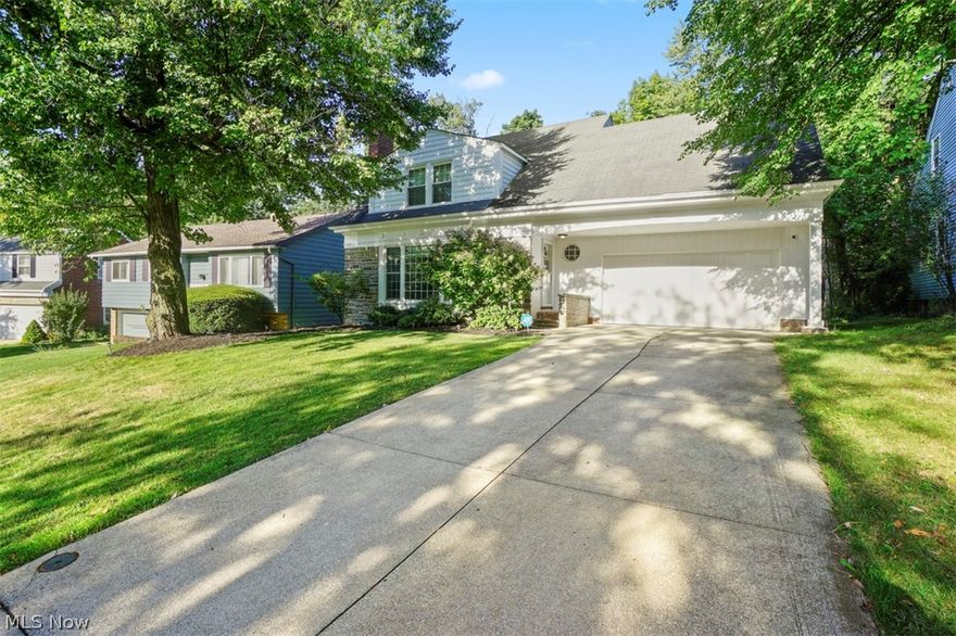 Come fall in love with this beautifully maintained South Euclid Colonial.  The spacious first floor rooms have gleaming vinyl plank flooring (new in 2021) throughout.  The living room is anchored by a woodburning fireplace and built-in shelves and cabinets.  A formal yet cozy dining room will make your family gatherings special.  Plenty of room in the kitchen, with a dining area and access to the attached 2-car garage.  Don't miss the the sunroom at the back, which leads to a beautiful deck with plenty of space for outdoor dining and grilling.  A half-bath completes the first floor.  Upstairs you will find 3 bedrooms and the full bath.  The master bedroom is grand, with a sitting alcove, an enormous walk-in closet and new carpeting (2021).  Bedroom 2 on the front of the house has two spacious closets.  Bedroom 3 on the rear of the house has a large cedar closet, and access to your upstairs porch overlooking the wooded backyard.  Hang out in the basement recreation room, featuring a sec