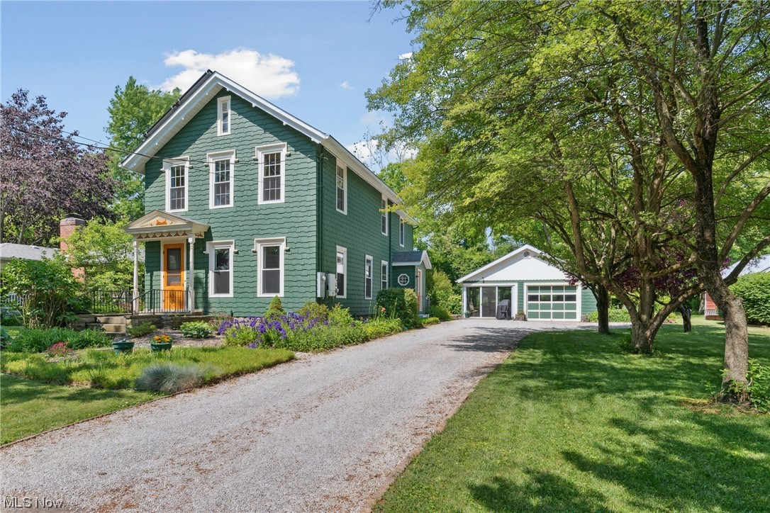 This well-maintained Colonial home with historic charm and a 1990 2-story addition is located on one of the most beautiful streets in Oberlin, and is within walking distance to campus, downtown and recreational community walking trails. A lovely front portico leads into the entry foyer opening into a living room with plenty of windows and natural light. A large south-facing bay window is the focal point of the dining room large enough for your dining hutches! The kitchen has plenty of countertops and storage cabinets, and is conveniently accessed from the garage via a side vestibule/mud-room. The kitchen and the dining open into a large multipurpose room with an attached half bath on the main level, which could easily be converted to a first floor bedroom with a full bath. Upstairs are 4 nice-sized bedrooms that share a full bath with a walk-in shower. The large primary bedroom has a study/hobby room that has provisions to be easily converted to an attached full bath. Desirable feature