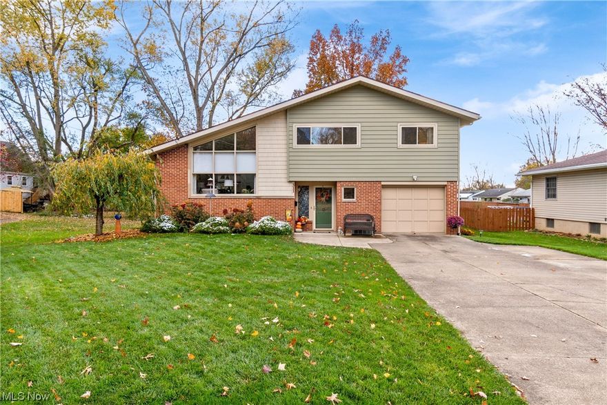 This Vintage Split Level that has always caught your eye is "For Sale".  Opportunity is here.                                                                This home has been so loved and it shows.  Entering into the Foyer is opened with a unique centered brass doorknob. Quality ceramic tiles lead you to the half-flight stairs and into the inviting Living Room. Fresh carpet and paint highlight this lovely, vaulted space. The trapezoid windows follow the lines of the vaulted ceiling. The natural birch woodwork travels up the iron and wood stair railing and throughout the home.  Dining room offers a view of the backyard through the newer-quality window.  Around the corner is the recently updated Kitchen. From top to bottom, the Kitchen has it all.  The GRANITE countertops cover the custom cabinets with precision.  The GLASS TILE backsplash and the BLACK STAINLESS-STEEL appliances complete the Kitchen beautifully. The Family Room is open to the Kitchen and complete with brick wood-burning FIREPLACE and hearth. This level is without steps through door to back patio, laundry room, and garage. Upstairs are the 3 bedrooms, freshly painted and carpeted.  Original Hardwood floors are under bedroom carpets. Each room has custom window treatments and spacious closets. The full bath has new flooring and tub/shower. The clean and fresh look of bath is inviting. The large linen closet is spacious and offers entrance to attic which includes even more STORAGE.  Even in the back yard, there are 2 STORAGE sheds. In the lower level is the finished workroom with glass block windows, carpet, and cozy auxiliary heat.  The Lower-level full bath is complete with shower.  Come see this well-loved home.