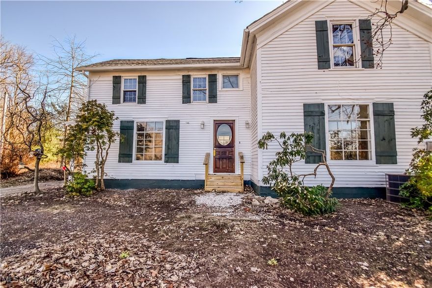 Welcome Home! Everything has been done for you! This spacious home on over 1.5 acres of land boasts with charm and updated features. Enter through your new laundry/mud room, great for catching all of your work and play clothes. Next a new bathroom with a newly tiled shower, perfect for guests or a shower after work or a workout. Your new kitchen has all new appliances, an island, new cabinets and counter, and a wall of original built-ins, great for tons of storage. A brand new porch off the kitchen invites you seasonally, to sit for morning coffee or afternoon tea. Spacious living and dining rooms, Upstairs you will find 3 bedrooms, all with a bathroom of their own, and a bonus room, great for a play room or an office. New lighting throughout, all new toilets and tiled showers, master bath has a beautiful soaking tub and chandelier. There is a covered porch in the back yard, all new gutters, and a spacious detached garage. New AC unit will be installed before closing. Close to schools and minutes from shopping and dining.