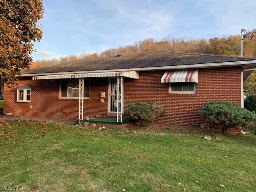 This a great one level (no basement) 2 Bedroom, 1 Bath, Brick Ranch with a 2 car detached garage in the rear approx. 24 x 24 built in 1991.  Perfect home for starting out or downsizing with a large family room with sky light for entertaining.  Nice stamped concrete parking pad in front  Financing type is Conventional only.  Taxes Homestead.