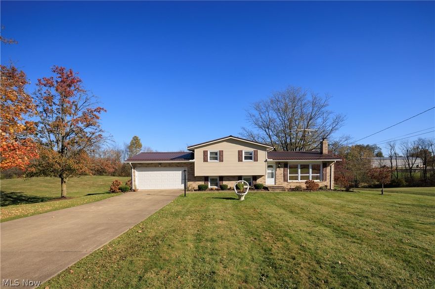 This beautiful 4 bedroom, 4-level split home is situated on an amazing 1.52-acre lot in the Tuslaw area. Many updates have been completed throughout the years: 2017- Metal roof, vinyl siding- 2011 Furnace and Central Air, 1997 Windows...too many improvements to list them all. This property boasts hardwood floors in the large living room, 3 upper bedrooms, stairs, and hallway. The 4th bedroom is located on the lower level and includes built-in shelving for collectibles. This home also includes a spacious kitchen, with a mobile island that you can place wherever you'd like, appliances, and access to the covered back porch. Enjoy movie night in the Family Room while snuggled up near the fireplace. There is direct access to the garage or the impressive backyard via the sliding glass doors. You'll love the country views and atmosphere! Pride of Ownership and Love is apparent when viewing this property. Sellers are willing to sell each parcel individually: Parcel #07202465 includes the house