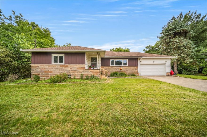 Welcome home to this freshly painted ranch, nestled on nearly an acre in a desirable Macedonia neighborhood.  Step into the foyer and you'll immediately appreciate the spacious living room featuring a picture window,  hardwood floors and a brand new electric fireplace with a custom mantle.  This well-designed 3 bedroom /1.5 bath 1396 SF home is ideal for one floor living.  The full bath includes an updated vanity, and the kitchen comes fully equipped with a cooktop, oven, dishwasher, microwave and refrigerator.  Just off the dining area, an exterior door leads to a covered patio and fully fenced backyard--perfect for your 4 footed friends and outdoor entertaining.  A large backyard shed provides additional storage for you lawn equipment & tools.  The 1396 SF partially finished basement adds even more living space, including  a half bath, laundry area (washer & dryer included), and a versatile rec room ready to be transformed into your ideal game room, media lounge, or hobby space.  Though it may look modest from the outside, this home offers surprising space, comfort and functionality.  Attached is a 2 car garage with a workshop area.  Move-in ready and waiting for you to make it your own--don't miss your chance!  A one year America's Preferred Home Warranty will be the seller's gift to you.  Schedule your showing today and start your next chapter here.  Let's make it happen!