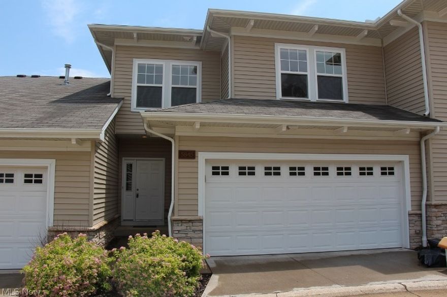 Move right into this "like new" unit in sought after StoneRidge....This Unit is in one of the most private and desirable locations in the Development.....Painted in todays colors. Terrific open floor plan with beautiful hardwood floors throughout main level. Large, light filled great room with 2 story windows and gas fireplace (with automatic switch starter). Custom kitchen with cherry cabinets and stainless steel appliances overlooking dining area with sliding glass doors to delightful deck. Second floor has 3 nice size bedrooms and 2 full baths. Master has own bath with large garden tub and separate shower....Full basement completely finished with built in bar.  First floor laundry room with newer front load washer and dryer. Attached 2 car garage, and plenty of storage. Close to restaurants and shopping!! Quiet neighborhood...Great Location! Minutes away from I-480 & 
I-77...maintenance free living at its best! MUST SEE.....