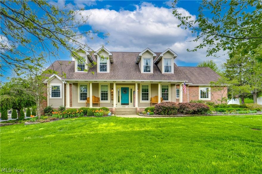 Welcome home to this beautiful conventional-style residence in the highly sought-after Jackson Local School District. From the moment you arrive, the brick-and-vinyl exterior, concrete drive, and charming front porch set the tone. Custom molding, thoughtful accent walls, and rustic touches woven throughout give this home a one-of-a-kind personality. The heart of the home is the soaring two-story great room, anchored by a gas fireplace and windows that flood the space with natural light. The adjacent kitchen is a true showpiece — featuring painted cabinetry and granite countertops. A barn-door pantry and an eat-in dining area with slider access to the back deck complete this chef's dream kitchen. The formal dining room and office/den, both sharing the same hardwood floors, round out the main living spaces beautifully. The first-floor primary suite is a true retreat, offering hardwood floors and custom pipe shelving. The en suite bath has been thoughtfully refreshed with quartz countertops, a double-sink vanity, a jetted soaking tub, and a spacious walk-in tile shower. A half bath, mudroom, and laundry room complete the first floor. Upstairs, an open hallway overlooks the great room below and leads to three additional bedrooms. A private mini-suite features its own en suite bath with tub/shower combo. Two additional bedrooms share a well-appointed Jack-and-Jill bath with a large single vanity. The partially finished walkout basement includes a recreation space reimagined with a redone wet bar and island. A bonus room offers potential as a fifth bedroom. The custom gym features blacked-out ceilings and egress windows that bring in natural light. Plus, a redid half bath. Outside, the back deck overlooks a lovely backyard with a poured-concrete patio and thoughtful landscaping. The three-car attached garage provides convenience with direct basement access and extra storage. All of this, just minutes from Belden Village and the vibrant heart of Jackson Township.