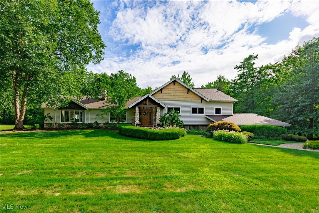 Welcome to this amazing home blending luxury, privacy, and modern living. Located in the sought after Hemlock Hills area of Novelty with just a short drive to downtown Chagrin Falls yet set in the natural beauty of Geauga County in top-rated West Geauga Schools. Optional HOA offers access to pool, playground, tennis courts, picnic area and social activities. Foyer welcomes you with views of nature through expansive windows from adjoining dining, living, and kitchen areas. Custom wood finishes adorn all main floor living areas including the living room which opens to eat-in custom kitchen with high-end appliances, custom cabinetry, granite countertops, and cooktop island. Expansive sun-filled family room off kitchen and living room has built-in storage, vaulted ceilings, and room to roam spanning from bayed front window to larger back deck. Just two steps up from the main living areas you’ll find all 4 BR’s. The luxurious master suite has room to rest and relax, a large walk-in closet and a spacious en-suite bath with dual vanities and walk-in shower. Master separated by hallway and laundry room from remaining 3 spacious BRs and 2 shared baths. Lower level rec room with walkout to extra parking space offers large, flexible area for customized use; a home theater, game room, gym, etc. Additional storage and separate office finish off lower level with access to garage. Inviting front porch and patio plus two sizeable decks in back for privacy. Large deck leads to 3-season gazebo with electricity. The other is Hot Tub Ready and adjoins to Master Suite. Surrounding yard and woods allow for enjoyment of wildlife all year round. Meticulously maintained and updated. Major improvements: new septic system ('21), upgraded water treatment system ('23), new furnace/AC ('23), and new roof ('25). This home has it all; gracious living, natural outdoor spaces, and an enjoyable neighborhood experience. Schedule a private tour to experience this home’s beauty firsthand!