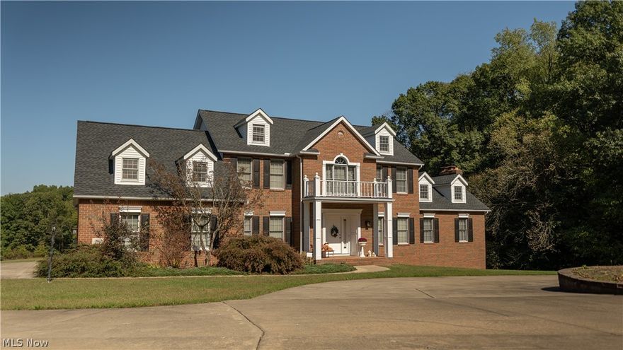 Incredible location in Green with over 3 acres! This stately brick home is full of classic beauty. Immediately notice the circle driveway & the beauty of this home. Out back is a beautiful view & a second story deck that is perfect to sit & enjoy the privacy this property offers! In the front door is a gorgeous 2-story foyer. Through the double doors is a large sitting room with newer flooring. The living room has an amazing cathedral ceiling with sky lights that offer lots of natural brightness. The gourmet eat-in kitchen features maple cabinets, granite countertops, large windows, & access to the second story deck. The large formal dining room is a perfect space for entertaining! It has crown-molding & a medallion in the center with a gorgeous hanging light. Down the hall is a half bathroom, a good sized first floor laundry room and a private office. Head up the stairs to the large 4 bedrooms & 2 full bathrooms! One of the bedrooms has a large window with a view of the balcony! Each