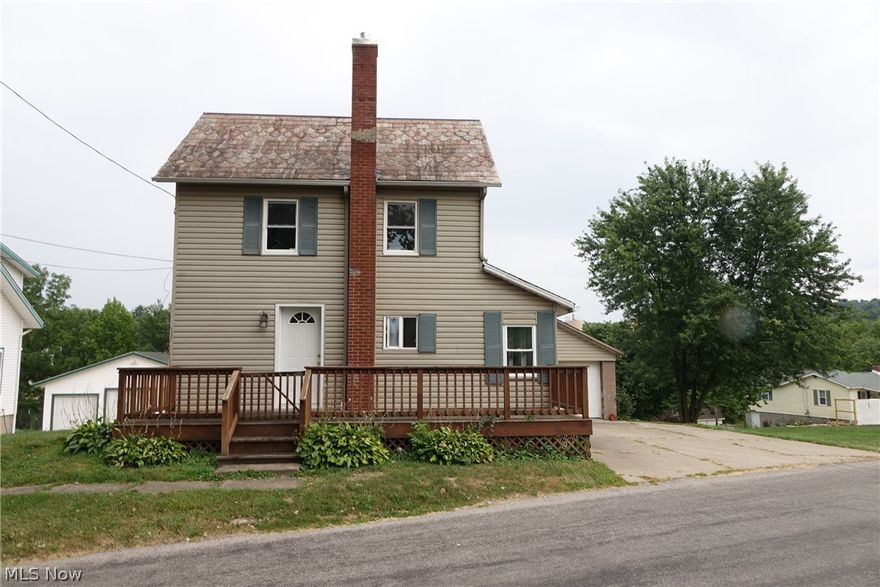 Totally remodeled interior from top to bottom, this cute home is ready to move in. The house has 2+ bedrooms 1 full bath 1 car garage. The beautiful kitchen has custom, locally made cabinets and comes with all the appliances, refrigerator, stove and microwave. The bathroom is totally redone as well with quality cabinets and corian counter tops. One bedroom is located on the main floor while there is a large bedroom upstairs. The basement has laundry room (appliances included) and utility room. Brand new gas heating stove, newer hot water heater and new plumbing. Check this one out!